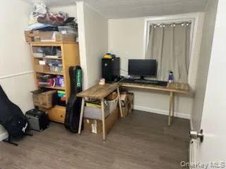 Office featuring wood finished floors and baseboards Office featuring wood finished floors and baseboards