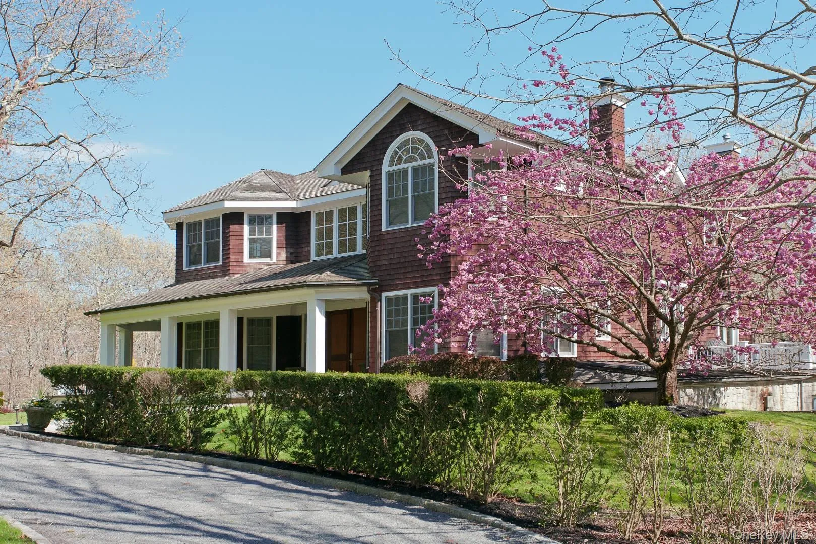 View of front of house featuring a chimney and a porch View of front of house featuring a chimney and a porch