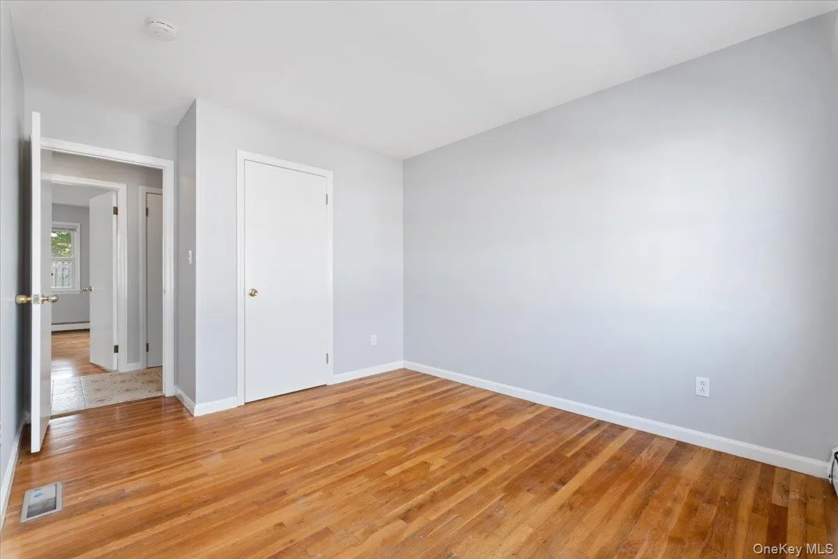Unfurnished room with light wood-type flooring Unfurnished room with light wood-type flooring