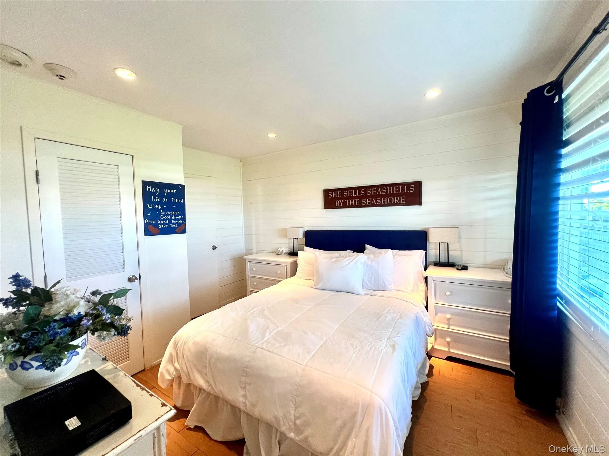 Bedroom featuring light wood-type flooring, a closet, and recessed lighting Bedroom featuring light wood-type flooring, a closet, and recessed lighting