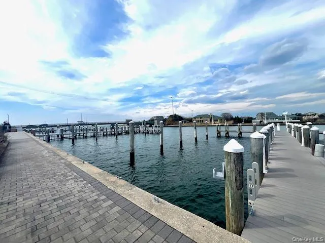Opposite unit. Dock featuring a water view Opposite unit. Dock featuring a water view