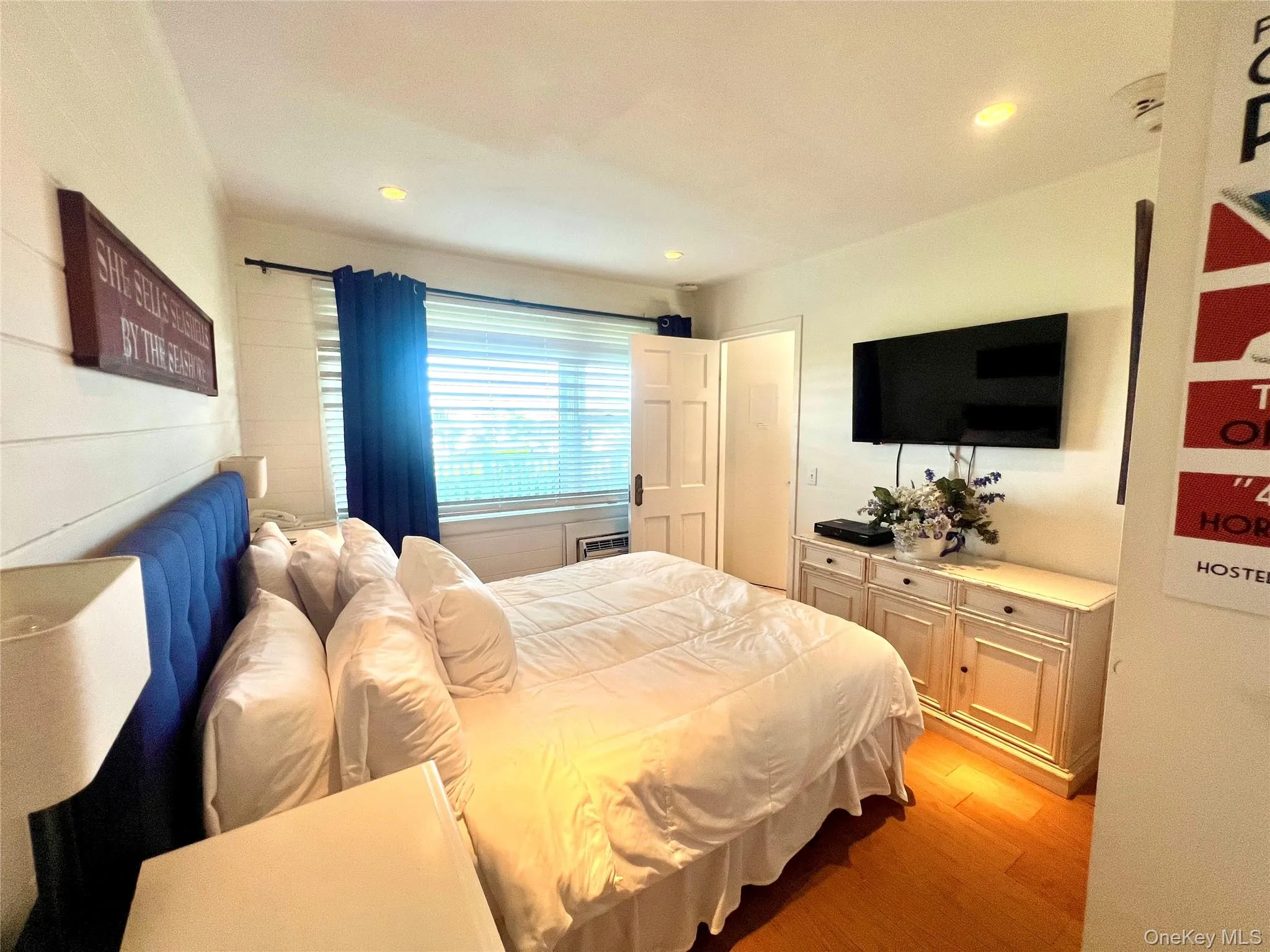 Bedroom with light wood finished floors and recessed lighting Bedroom with light wood finished floors and recessed lighting