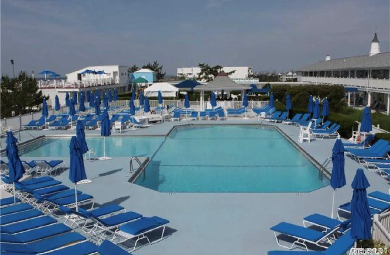 Community pool featuring a patio area Community pool featuring a patio area