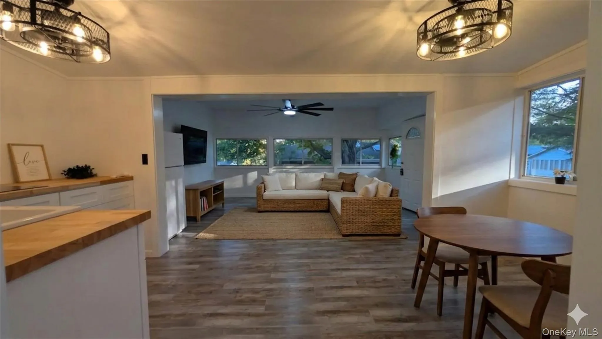 Virtual staging of the living/dining space with furniture. Original photo in following picture. Virtual staging of the living/dining space with furniture. Original photo in following picture.