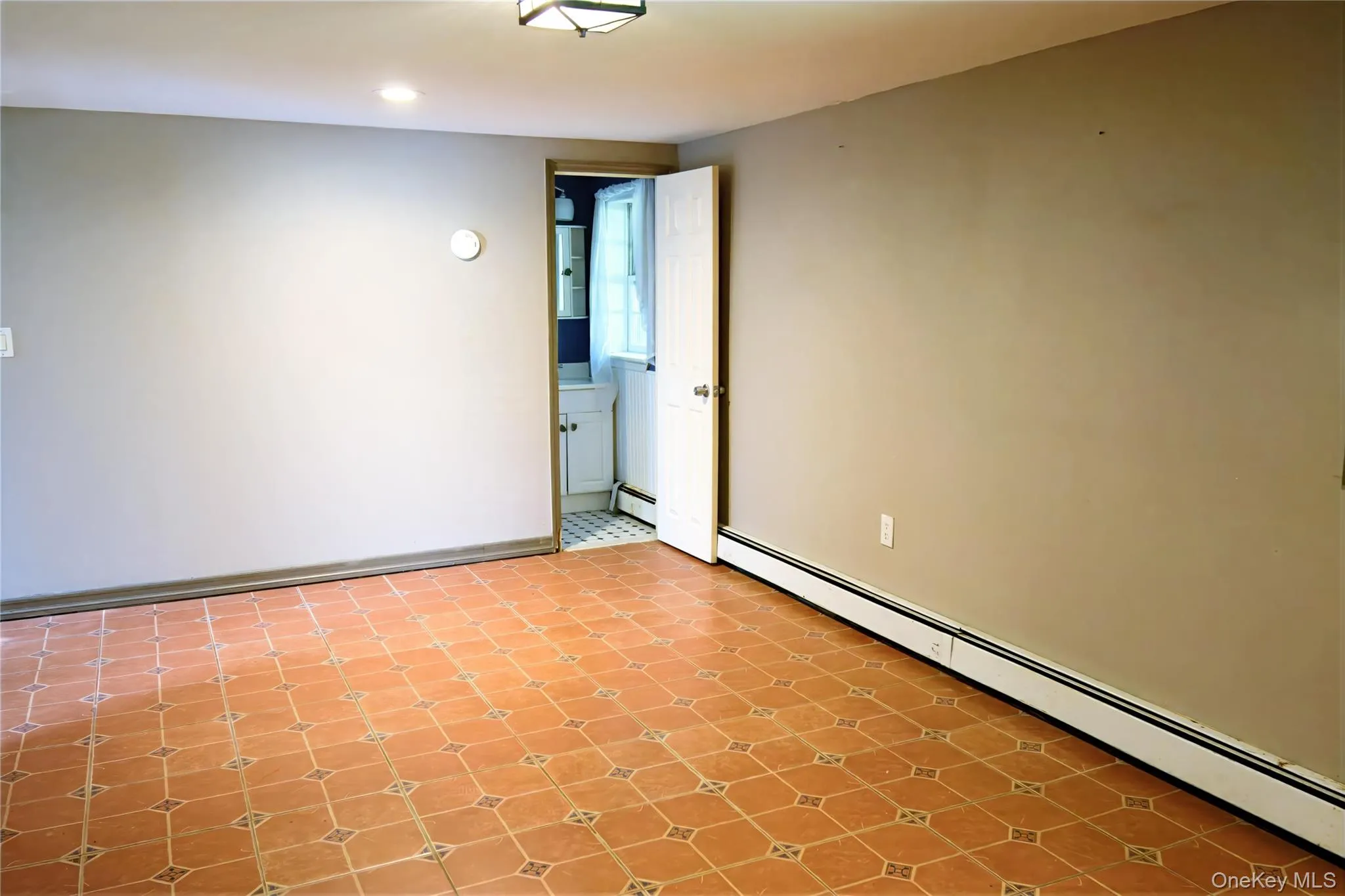 Spare room featuring baseboard heating Spare room featuring baseboard heating