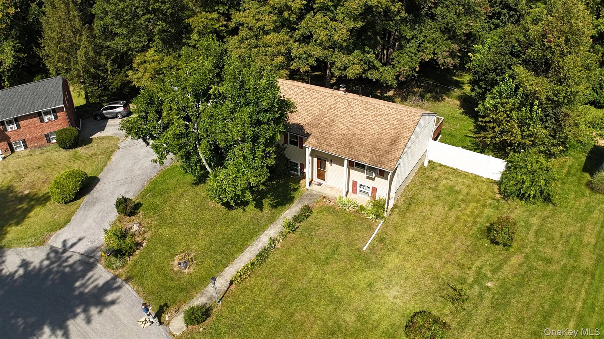 Aerial view of property and surrounding area featuring a forest Aerial view of property and surrounding area featuring a forest