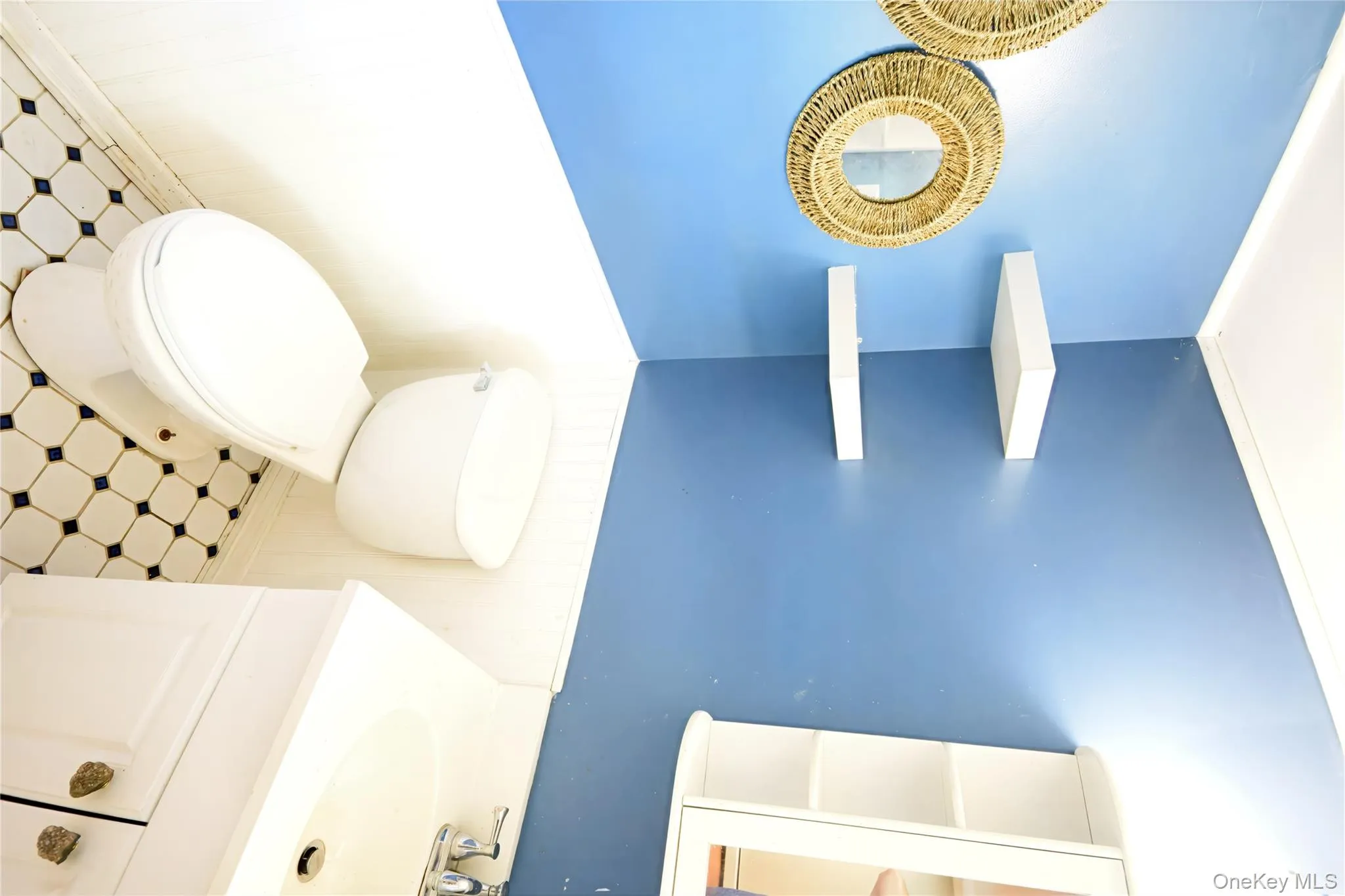 Bathroom with a wainscoted wall and vanity Bathroom with a wainscoted wall and vanity