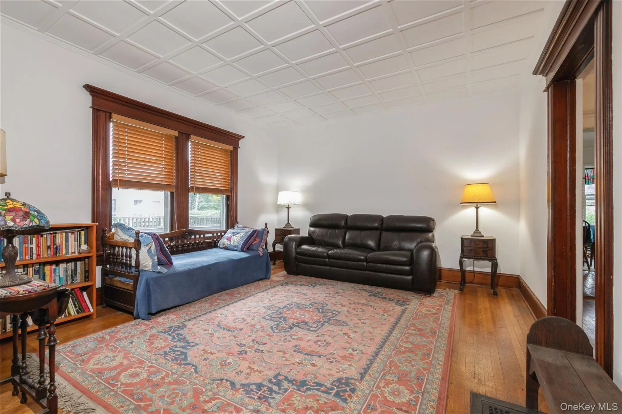 Living room featuring wood-type flooring and baseboards Living room featuring wood-type flooring and baseboards