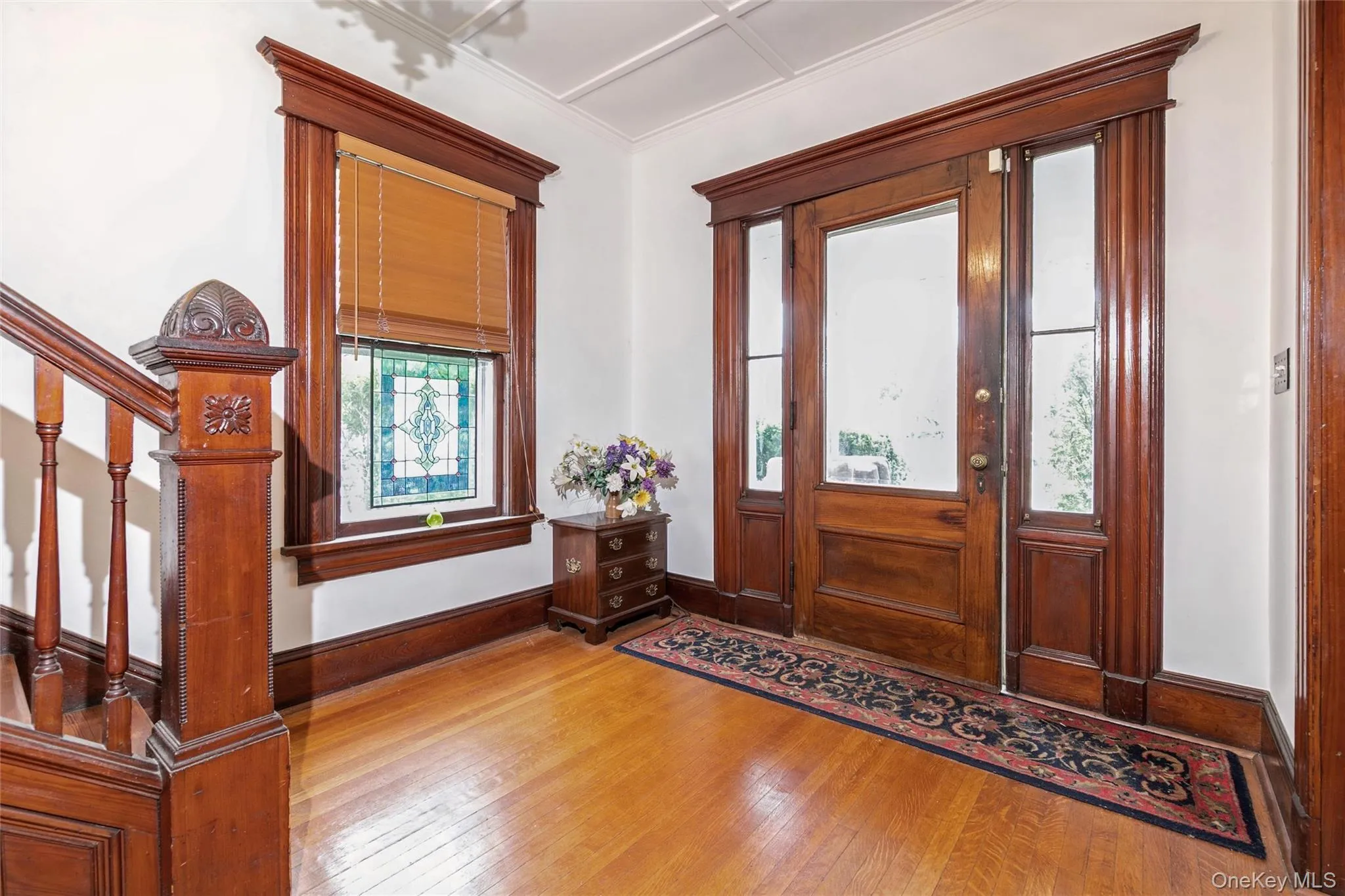 Foyer entrance with hardwood / wood-style flooring Foyer entrance with hardwood / wood-style flooring