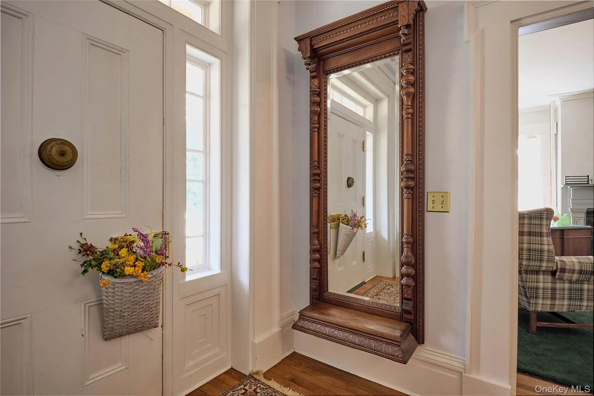 Entrance foyer featuring wood finished floors and plenty of natural light Entrance foyer featuring wood finished floors and plenty of natural light