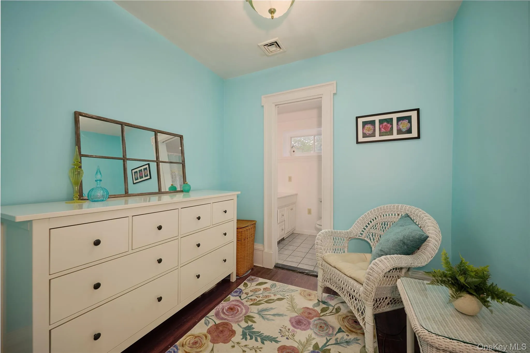 Living area featuring dark wood-style floors and baseboards Living area featuring dark wood-style floors and baseboards