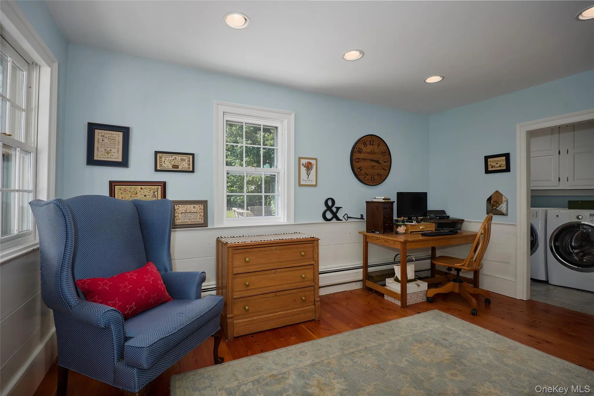 Office space with wood finished floors, recessed lighting, washing machine and clothes dryer, and wainscoting Office space with wood finished floors, recessed lighting, washing machine and clothes dryer, and wainscoting