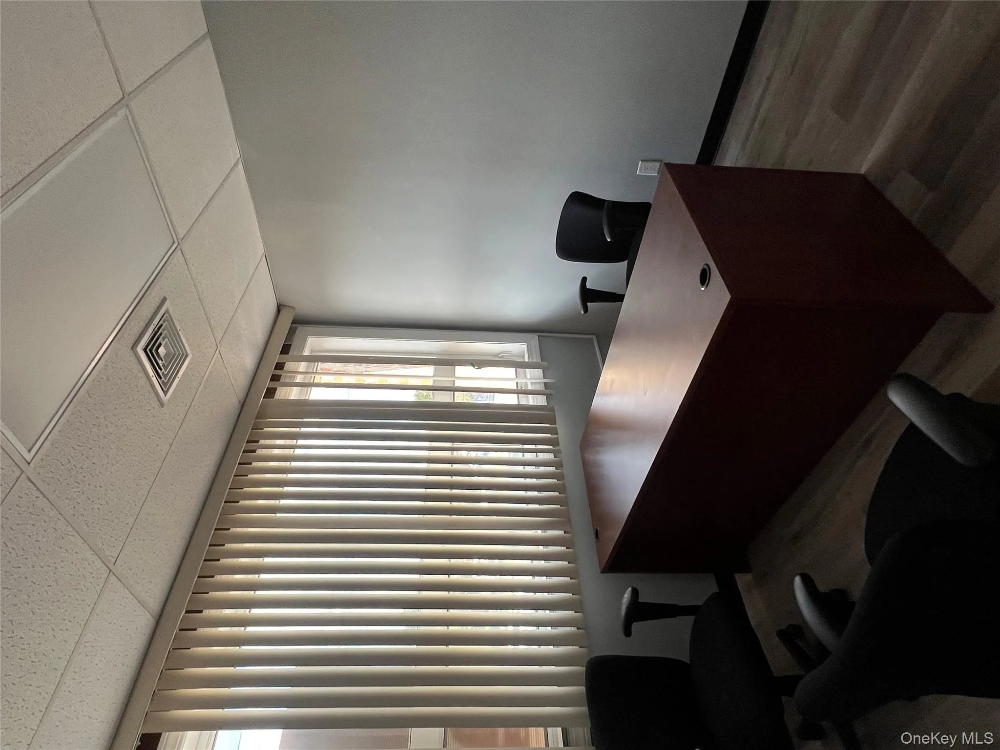 Home office featuring healthy amount of natural light, wood finished floors, and a paneled ceiling Home office featuring healthy amount of natural light, wood finished floors, and a paneled ceiling