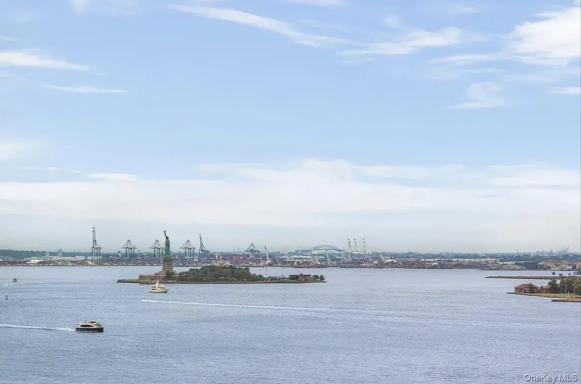 Water view featuring industrial structures Water view featuring industrial structures