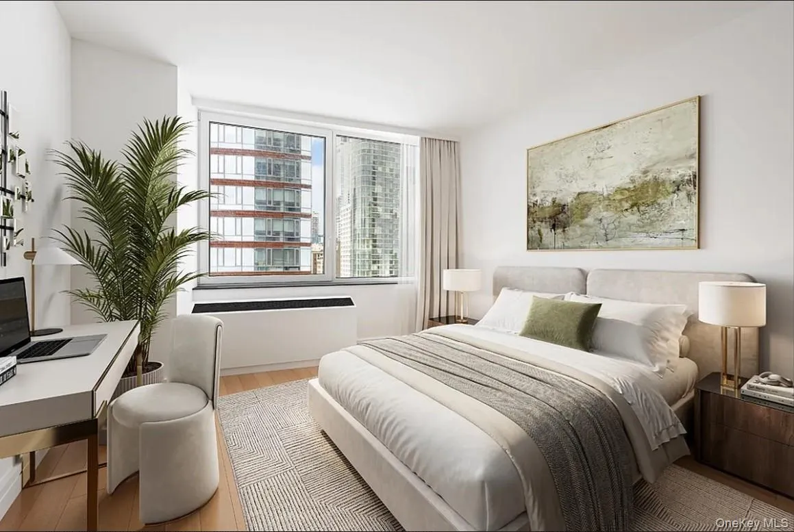 Bedroom with wood finished floors and a desk Bedroom with wood finished floors and a desk