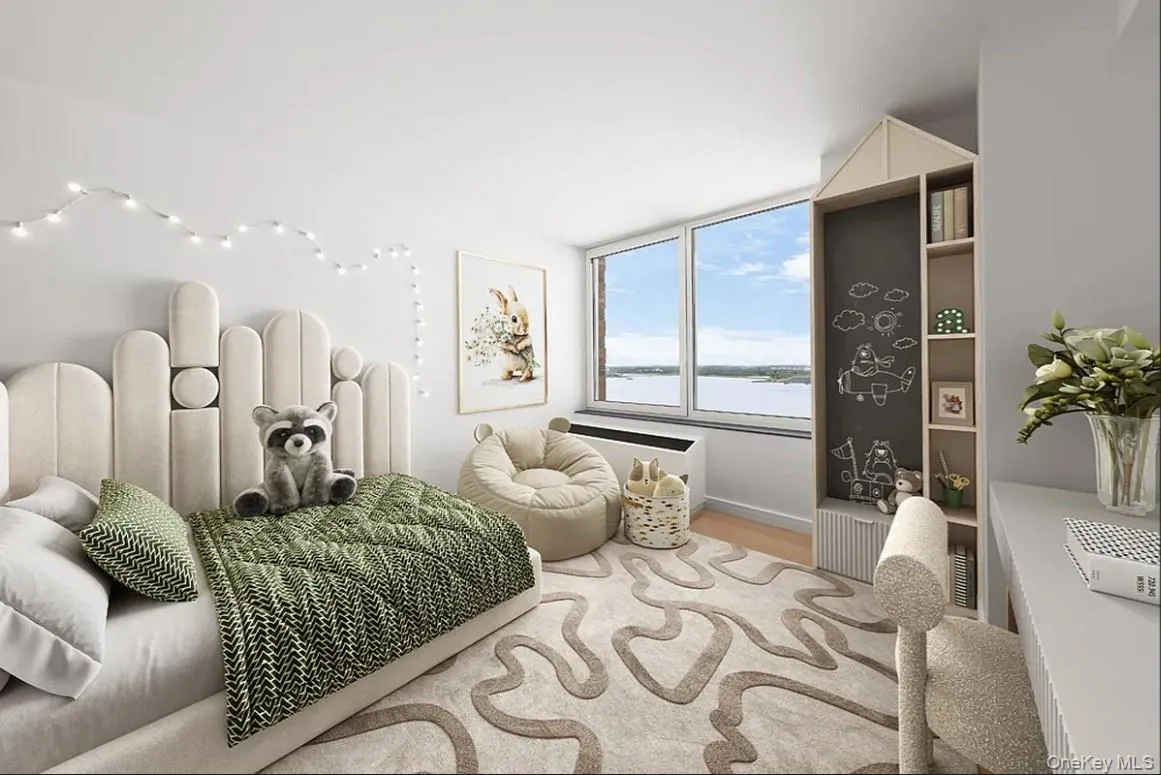 Bedroom featuring wood finished floors and a water view Bedroom featuring wood finished floors and a water view