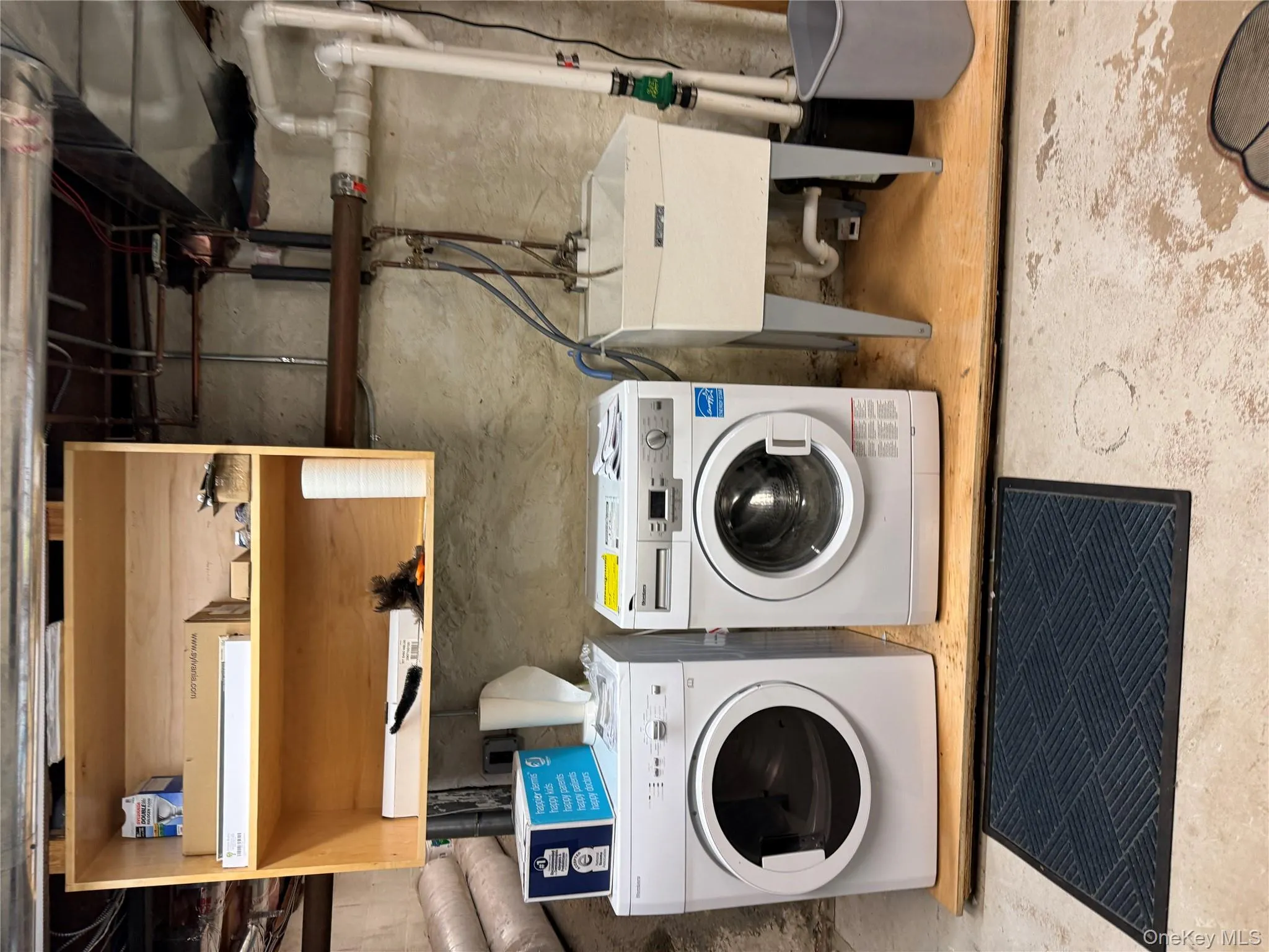 Laundry room featuring washing machine and clothes dryer Laundry room featuring washing machine and clothes dryer