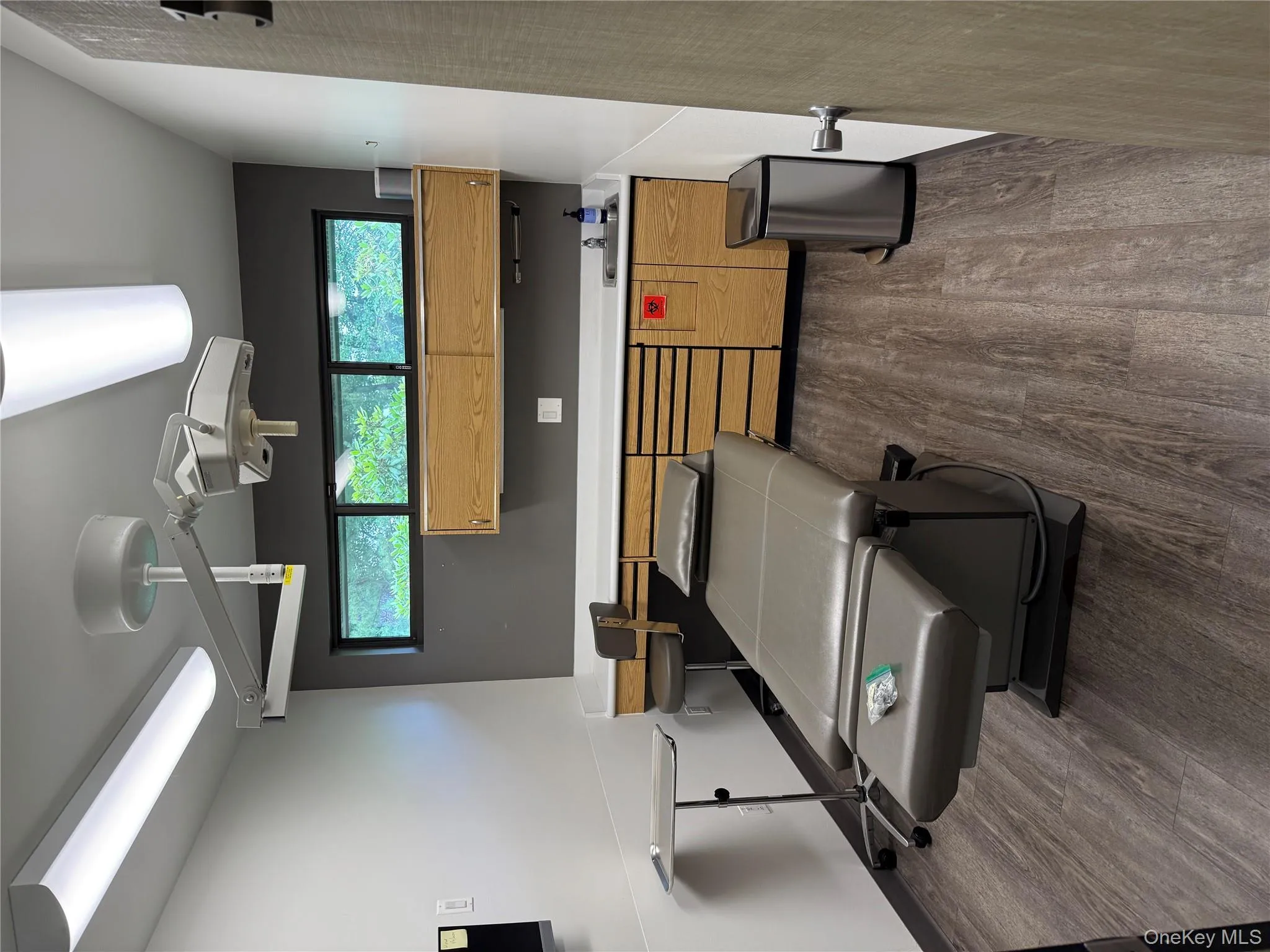 Kitchen with plenty of natural light, dark wood-style floors, and light countertops Kitchen with plenty of natural light, dark wood-style floors, and light countertops