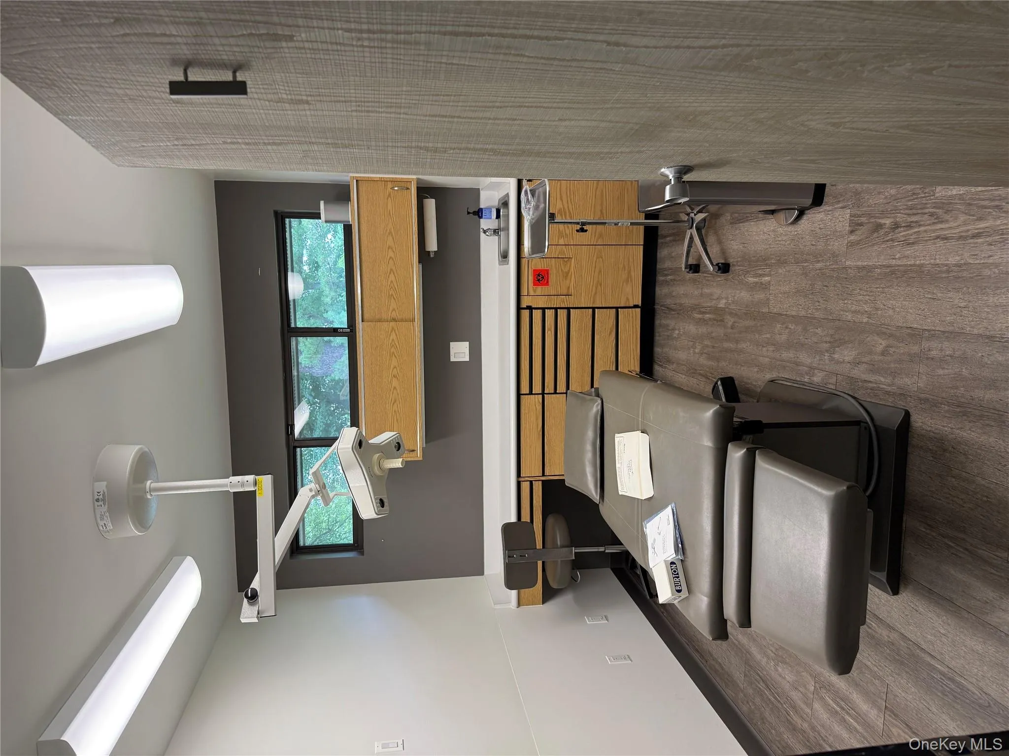 Exercise room featuring dark wood-style floors and baseboards Exercise room featuring dark wood-style floors and baseboards