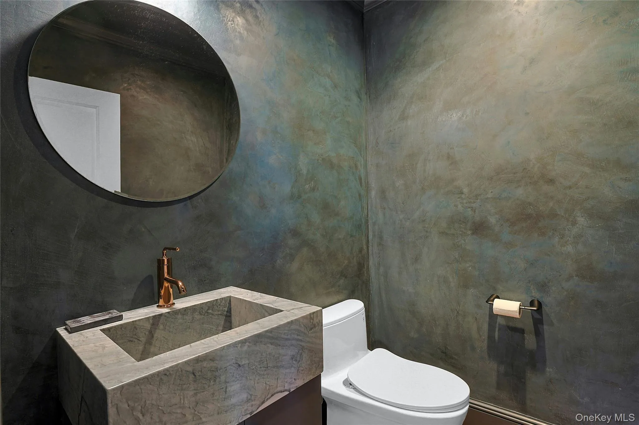 Bathroom featuring toilet and vanity Bathroom featuring toilet and vanity