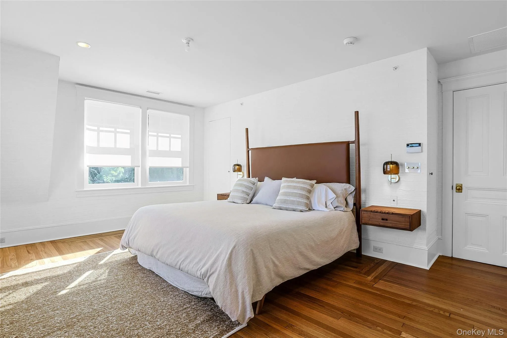 Bedroom featuring wood finished floors and recessed lighting Bedroom featuring wood finished floors and recessed lighting