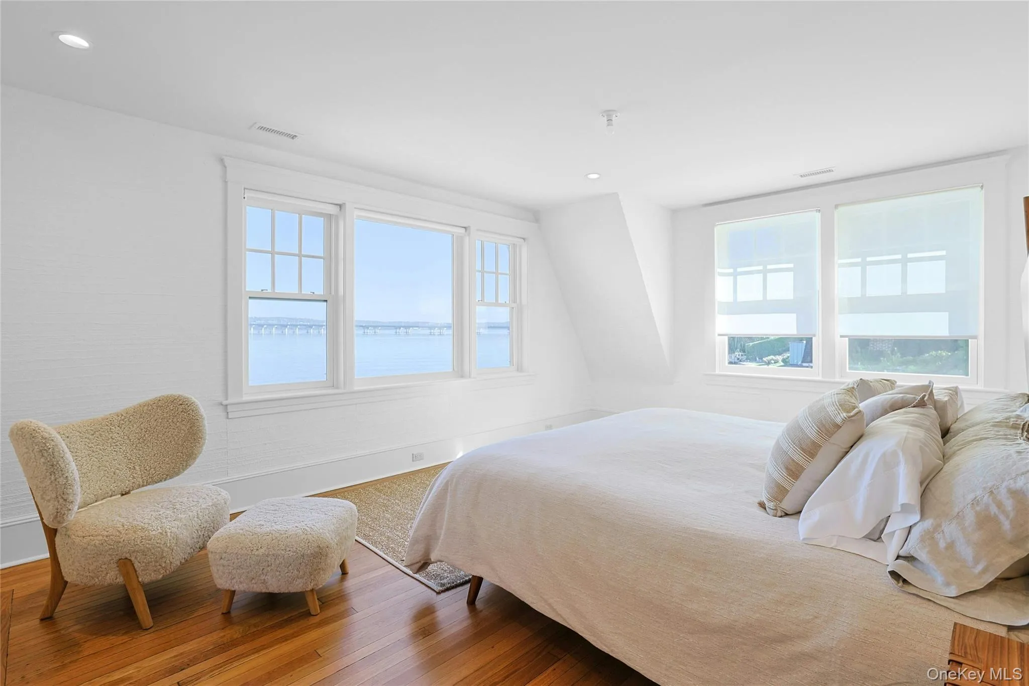Bedroom with wood finished floors and recessed lighting Bedroom with wood finished floors and recessed lighting