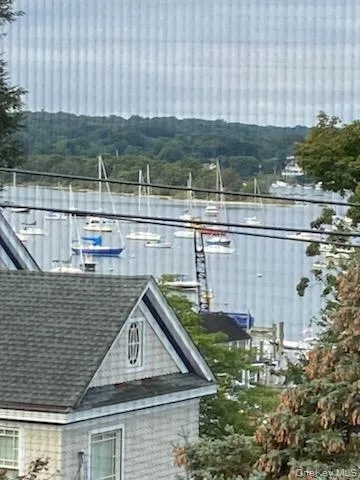 Water view featuring a heavily wooded area Water view featuring a heavily wooded area