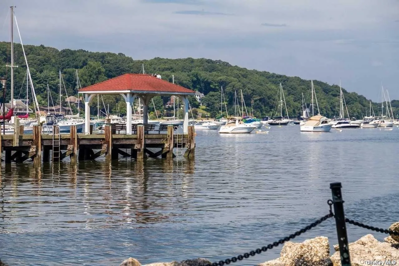 Dock with a water view and a forest view Dock with a water view and a forest view