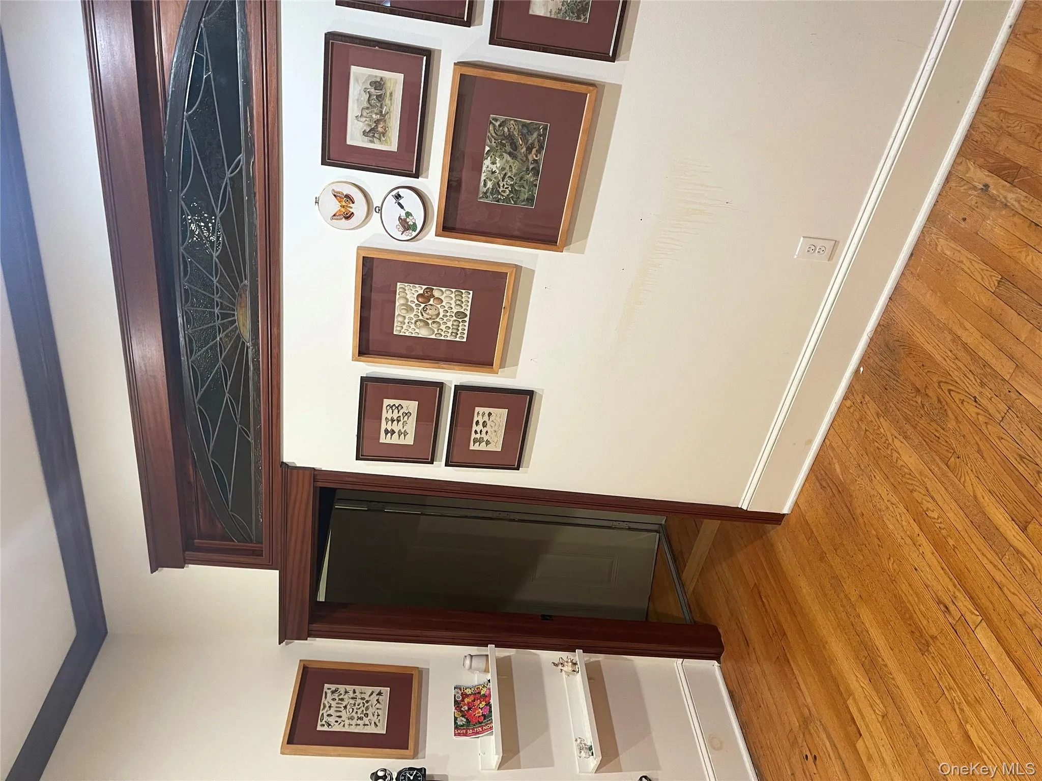 Corridor with light wood-style floors and ornamental molding Corridor with light wood-style floors and ornamental molding