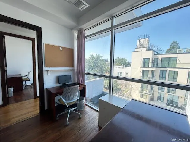 Home office with dark wood-type flooring Home office with dark wood-type flooring