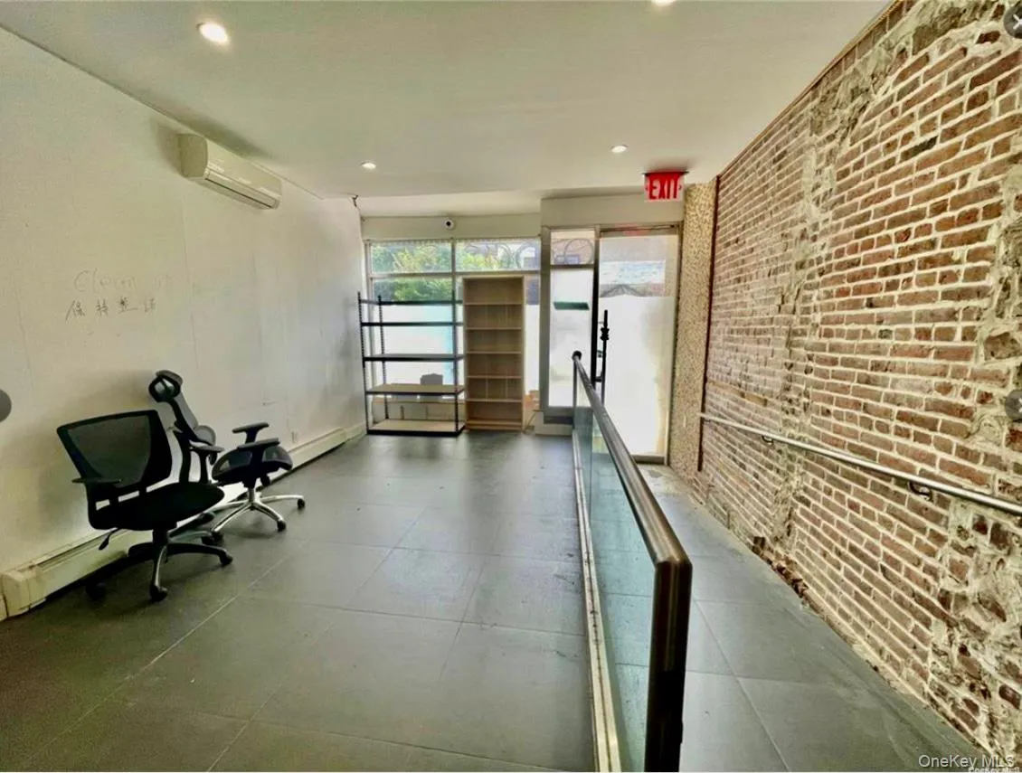 Lobby with brick wall and recessed lighting Lobby with brick wall and recessed lighting