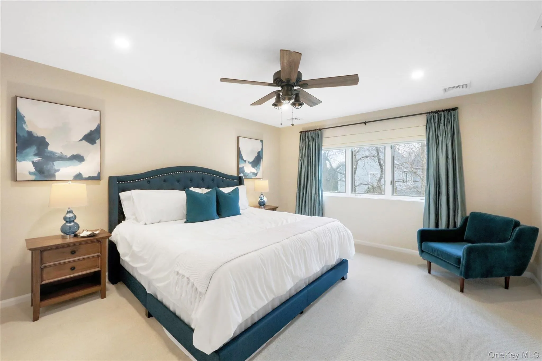 Bedroom with carpet floors, ceiling fan, and recessed lighting Bedroom with carpet floors, ceiling fan, and recessed lighting
