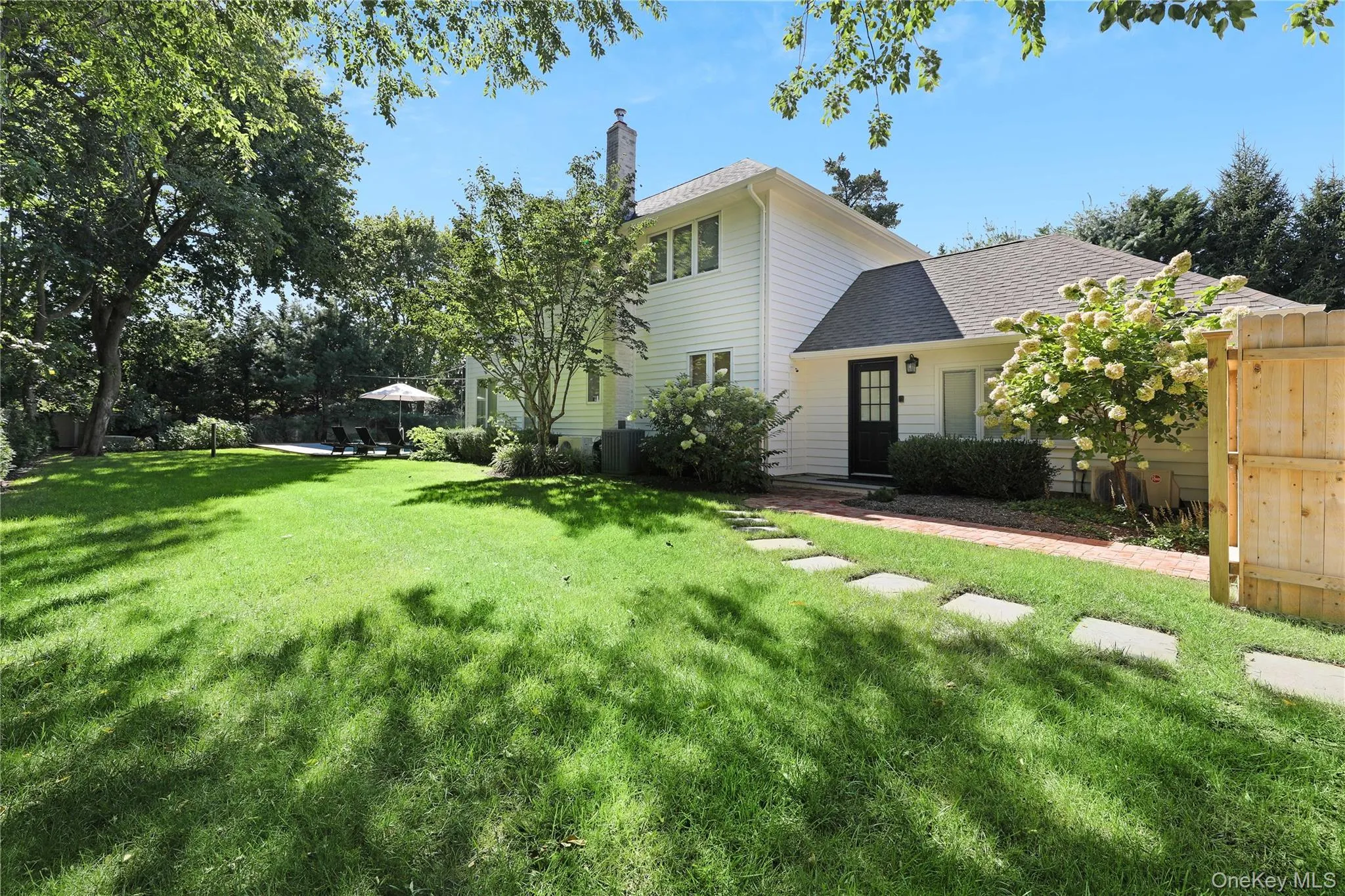 View of front of property featuring roof with shingles and a chimney View of front of property featuring roof with shingles and a chimney