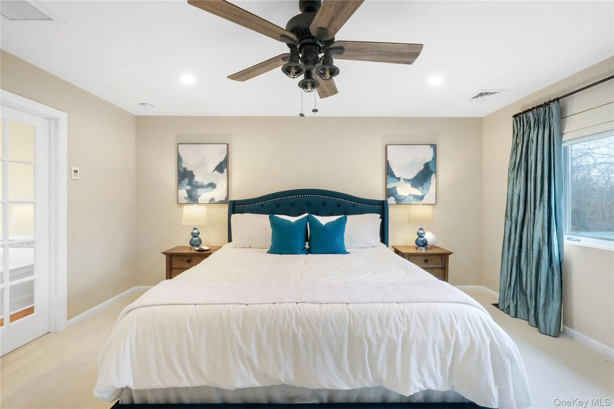 Carpeted bedroom featuring a ceiling fan and recessed lighting Carpeted bedroom featuring a ceiling fan and recessed lighting