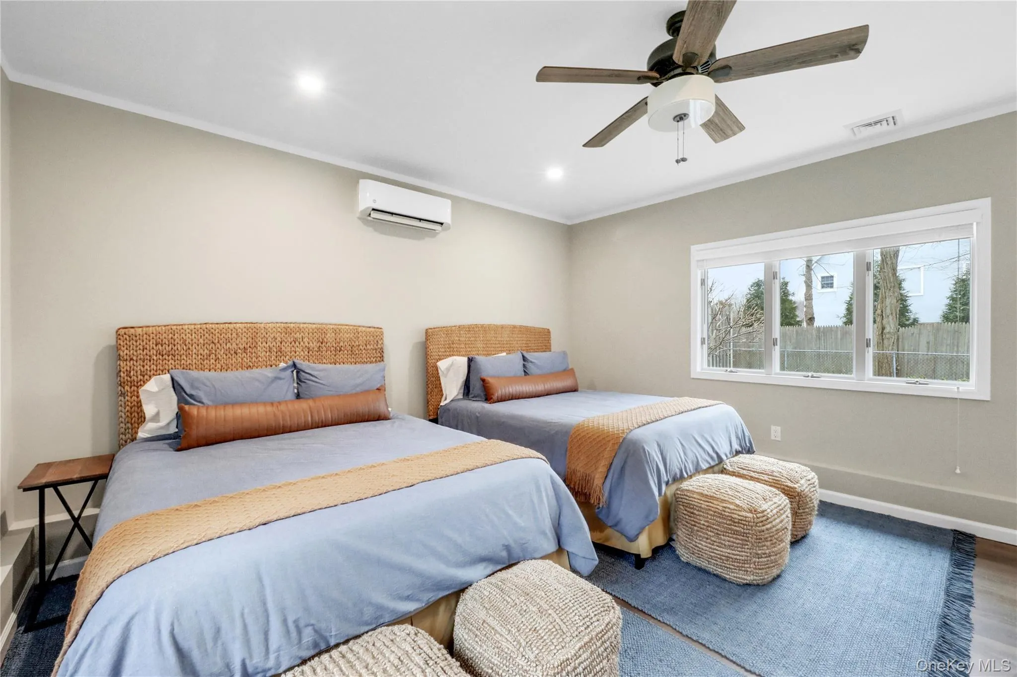 Bedroom featuring ornamental molding, recessed lighting, ceiling fan, and wood finished floors Bedroom featuring ornamental molding, recessed lighting, ceiling fan, and wood finished floors