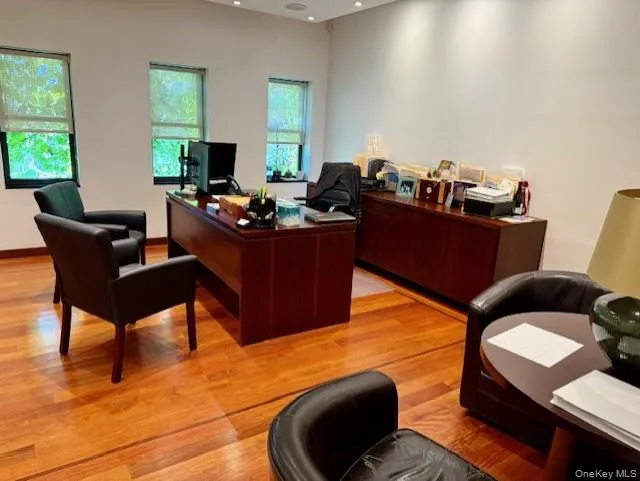 Office featuring light wood-style flooring and recessed lighting Office featuring light wood-style flooring and recessed lighting