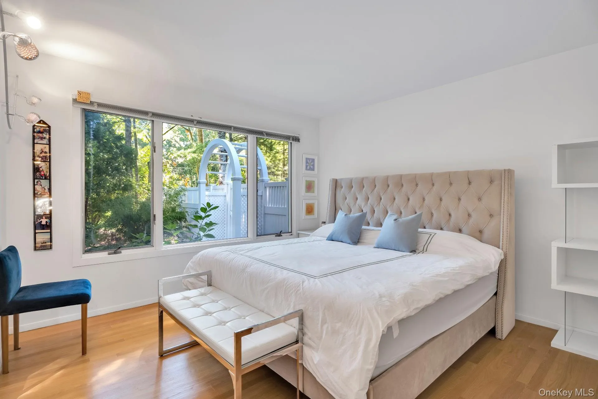Bedroom featuring wood finished floors and baseboards Bedroom featuring wood finished floors and baseboards