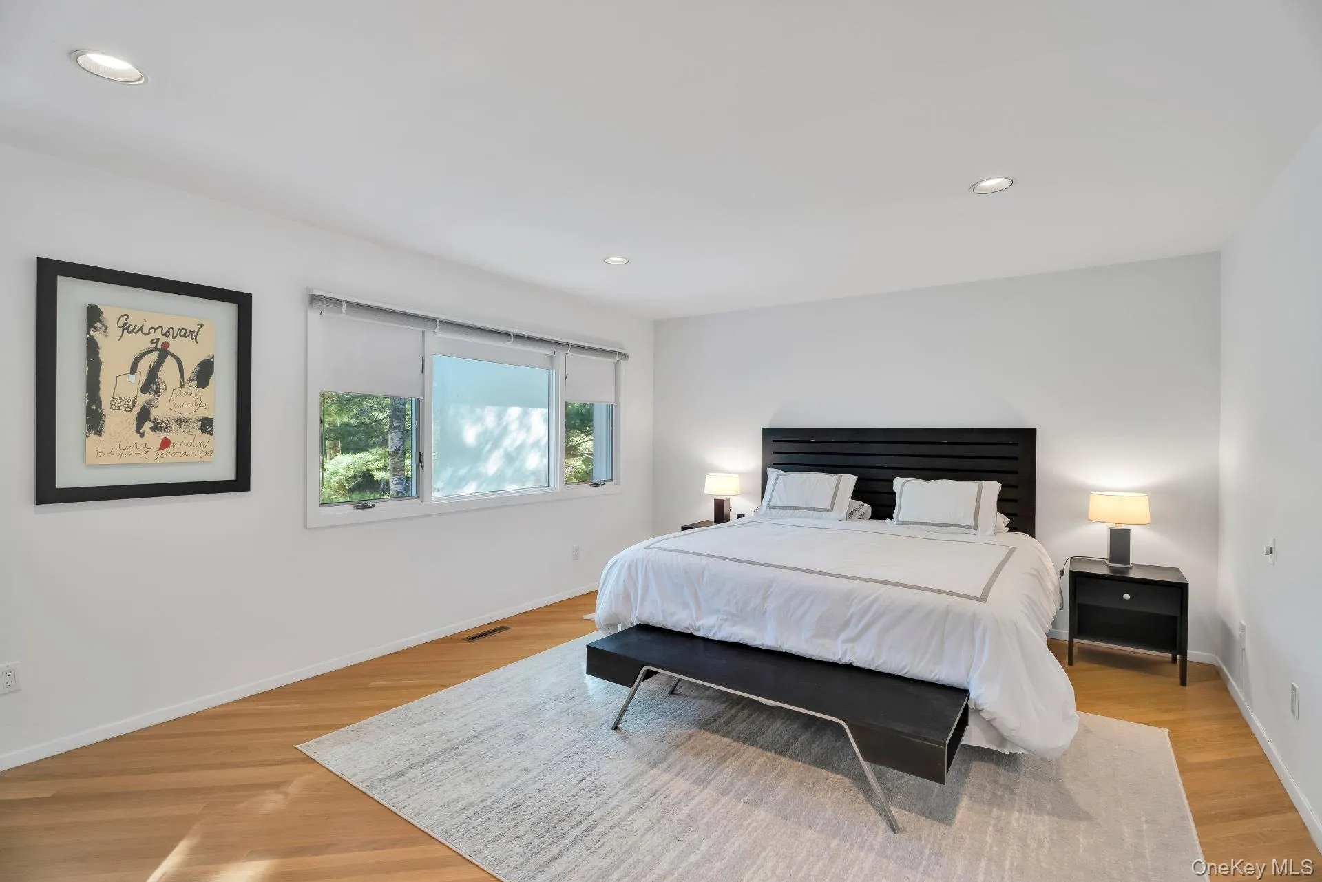Bedroom with recessed lighting and light wood-style flooring Bedroom with recessed lighting and light wood-style flooring