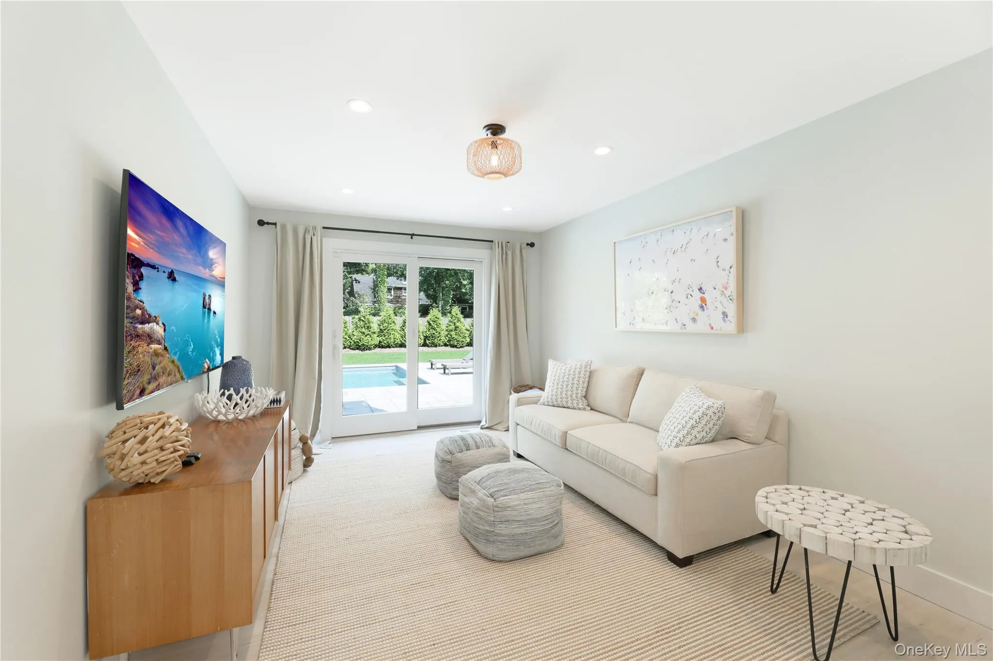 Living area with recessed lighting and baseboards Living area with recessed lighting and baseboards