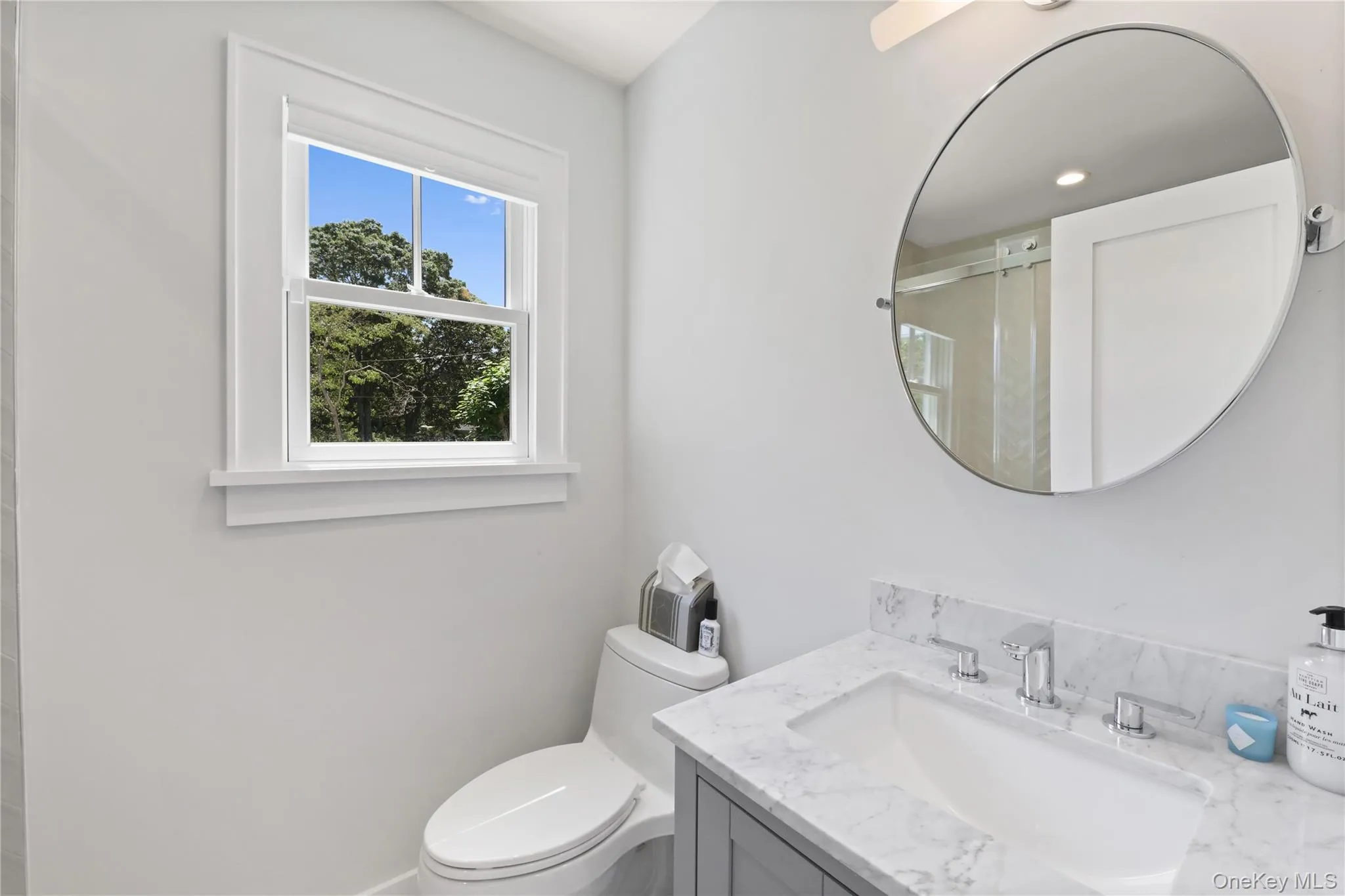 Full bath featuring vanity and a stall shower Full bath featuring vanity and a stall shower