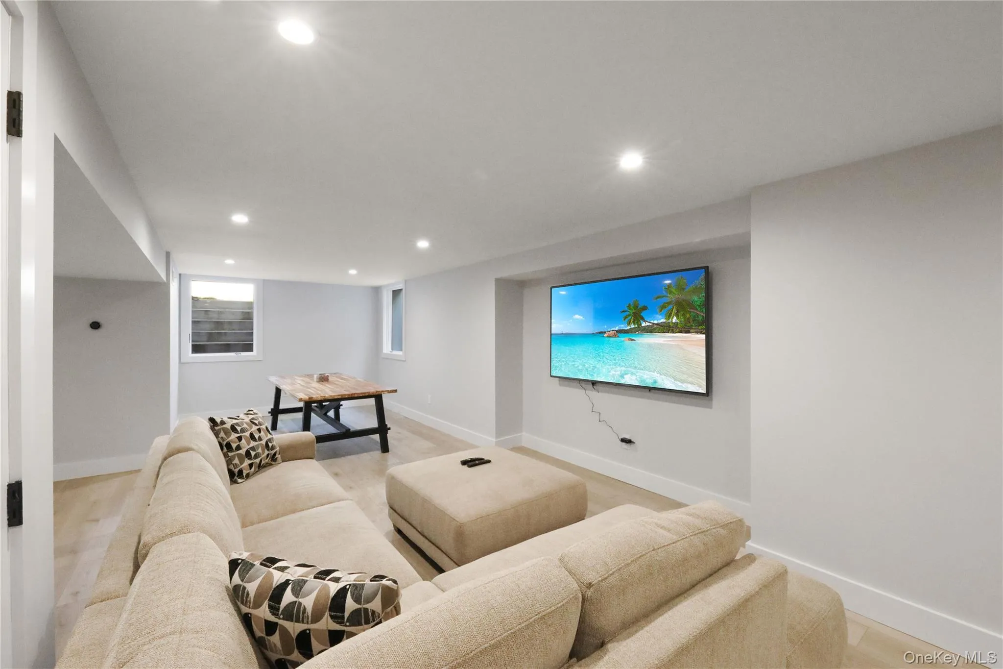Home theater room featuring recessed lighting and light wood-style floors Home theater room featuring recessed lighting and light wood-style floors