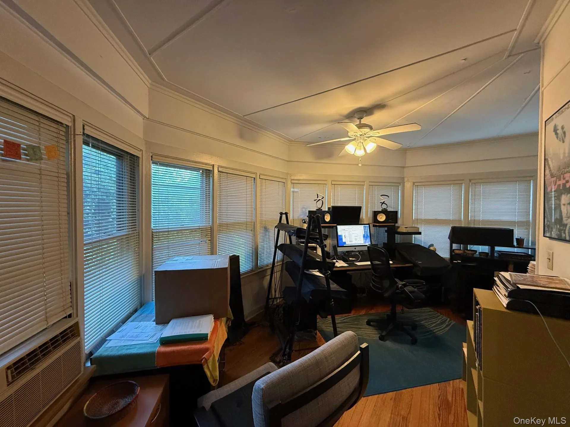 Office featuring wood finished floors, cooling unit, crown molding, and a ceiling fan Office featuring wood finished floors, cooling unit, crown molding, and a ceiling fan
