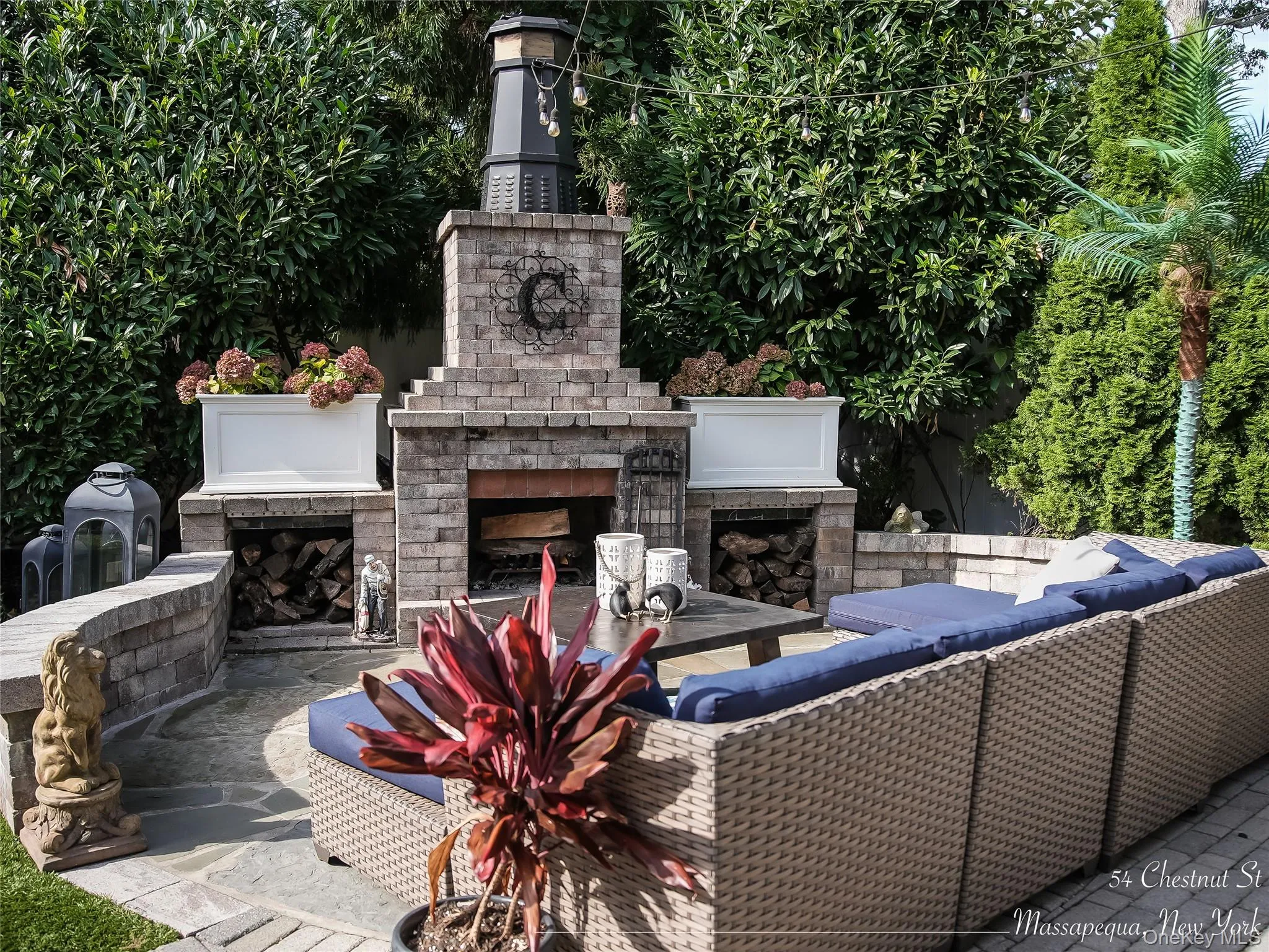 View of patio / terrace featuring an outdoor living space with a fireplace View of patio / terrace featuring an outdoor living space with a fireplace