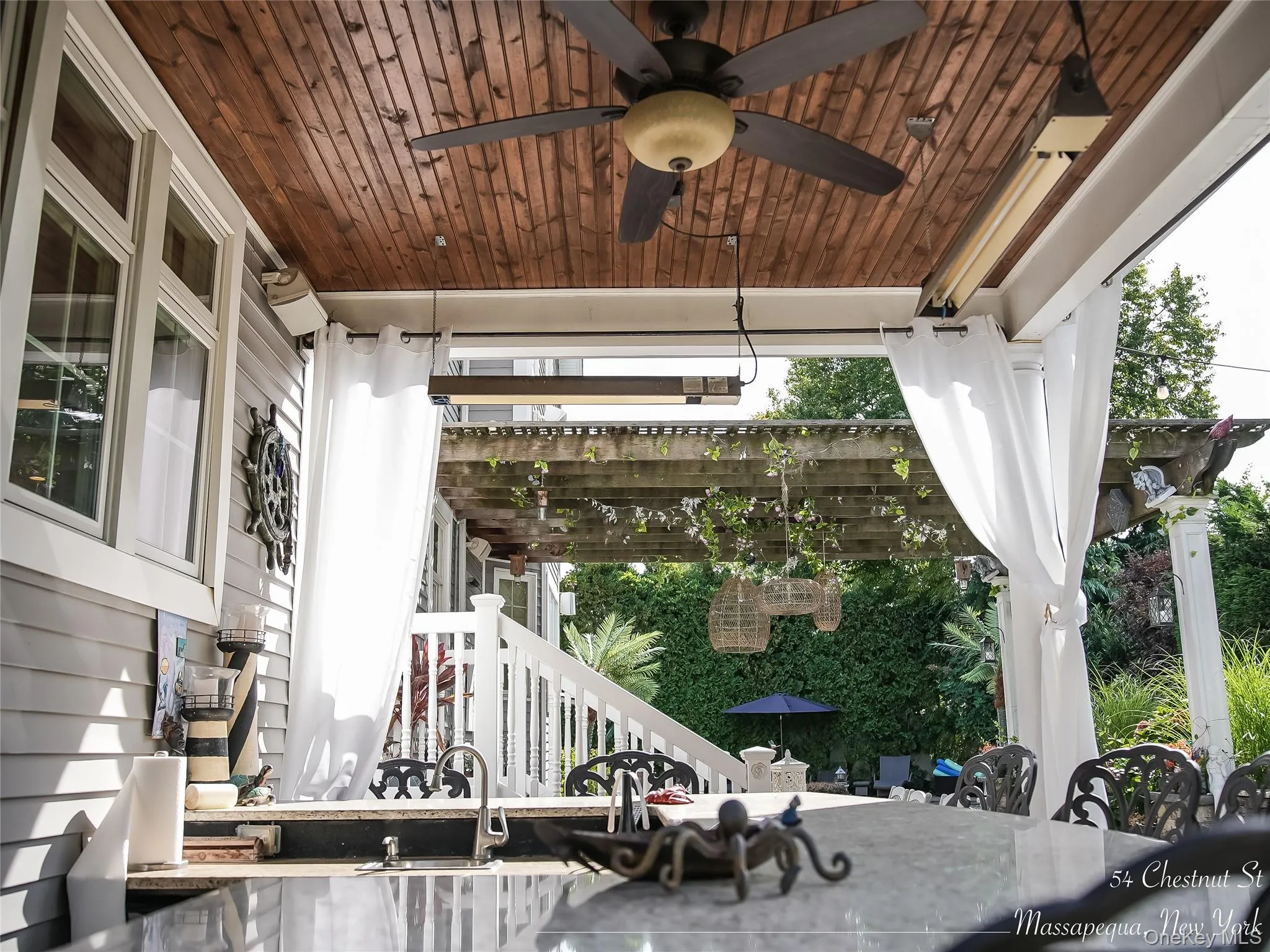 View of patio / terrace featuring a ceiling fan and stairs View of patio / terrace featuring a ceiling fan and stairs