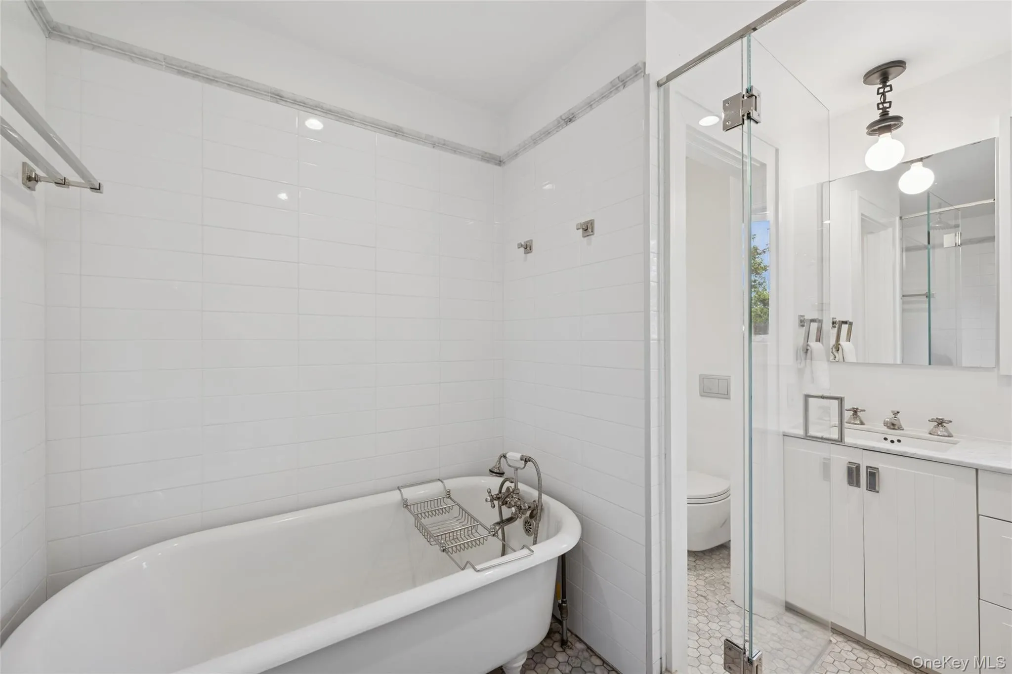 Bathroom featuring vanity and a freestanding tub Bathroom featuring vanity and a freestanding tub