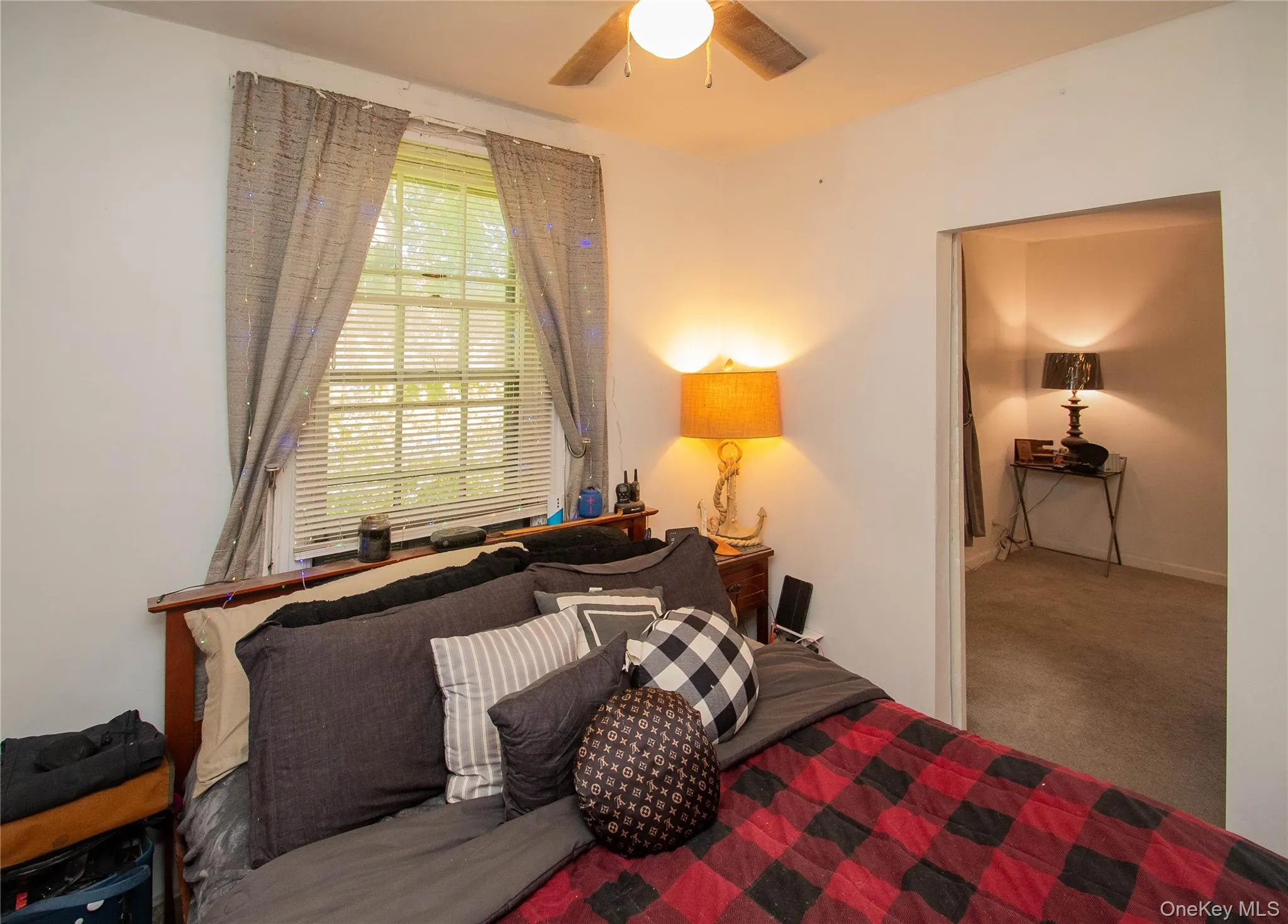 Bedroom with carpet and ceiling fan Bedroom with carpet and ceiling fan