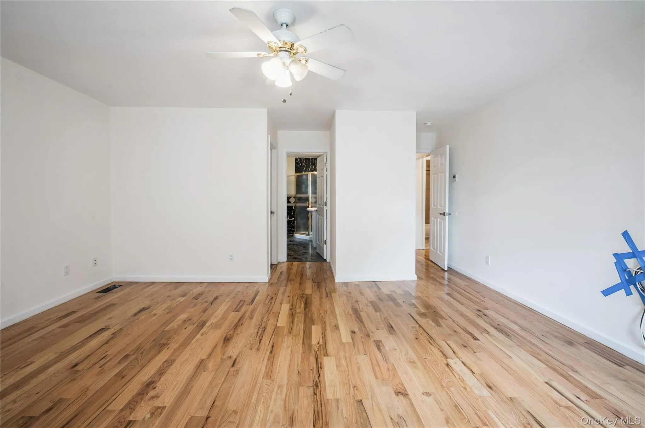 Very large primary bedroom with shining hardwood floors, ceiling fan, entrance to oversized en-suite walk-in closet and  gorgeous en-suit bathroom; shining hardwood floor, ceiling fan. Very large primary bedroom with shining hardwood floors, ceiling fan, entrance to oversized en-suite walk-in closet and  gorgeous en-suit bathroom; shining hardwood floor, ceiling fan.