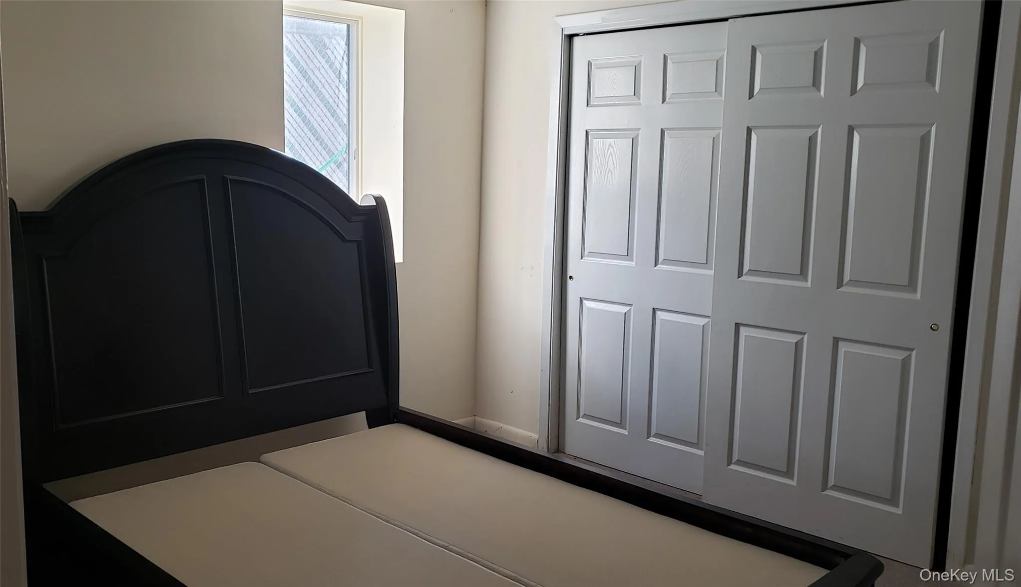 Unfurnished bedroom with baseboards and a closet Unfurnished bedroom with baseboards and a closet