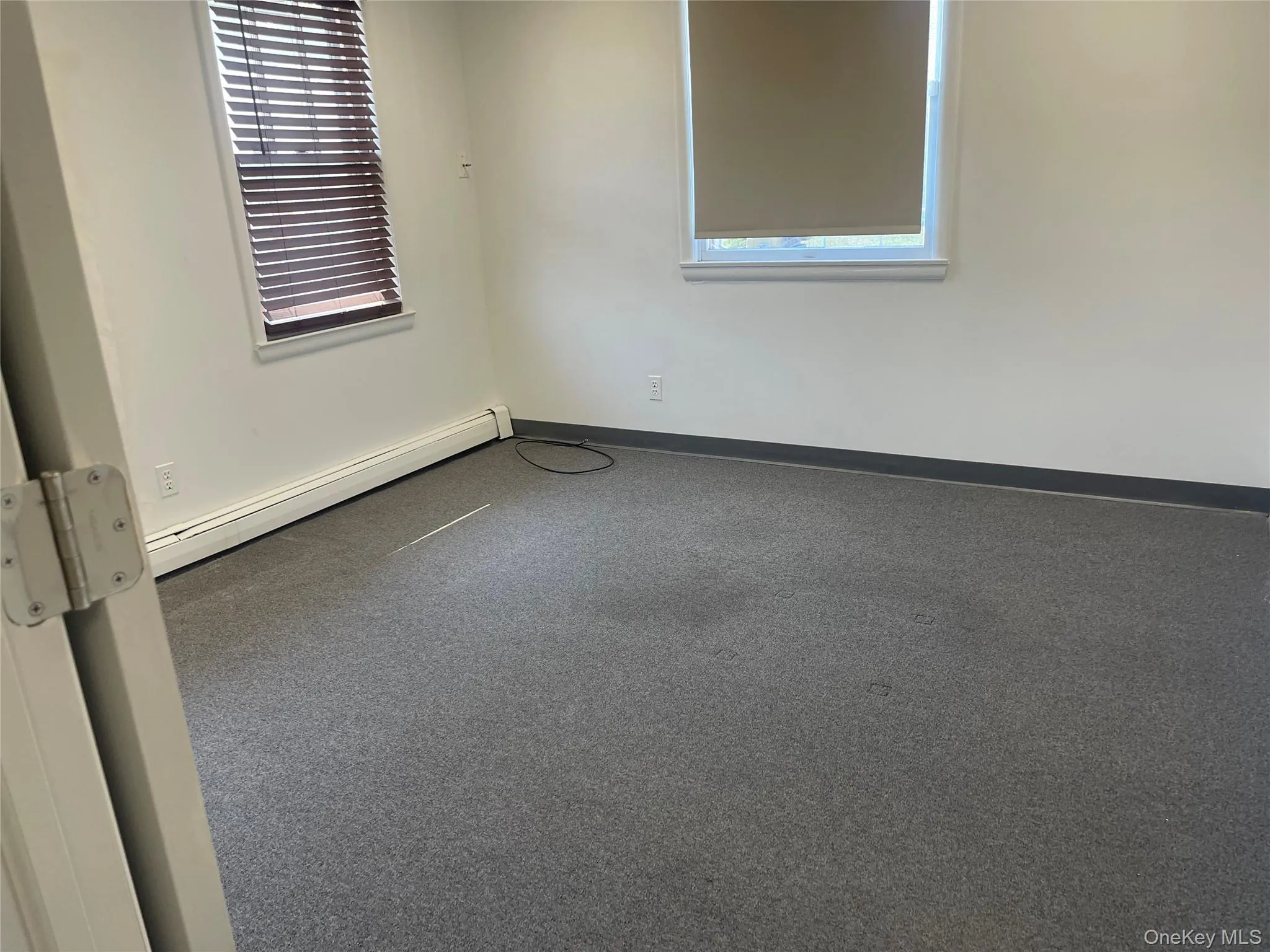 Office room featuring baseboard heating Office room featuring baseboard heating