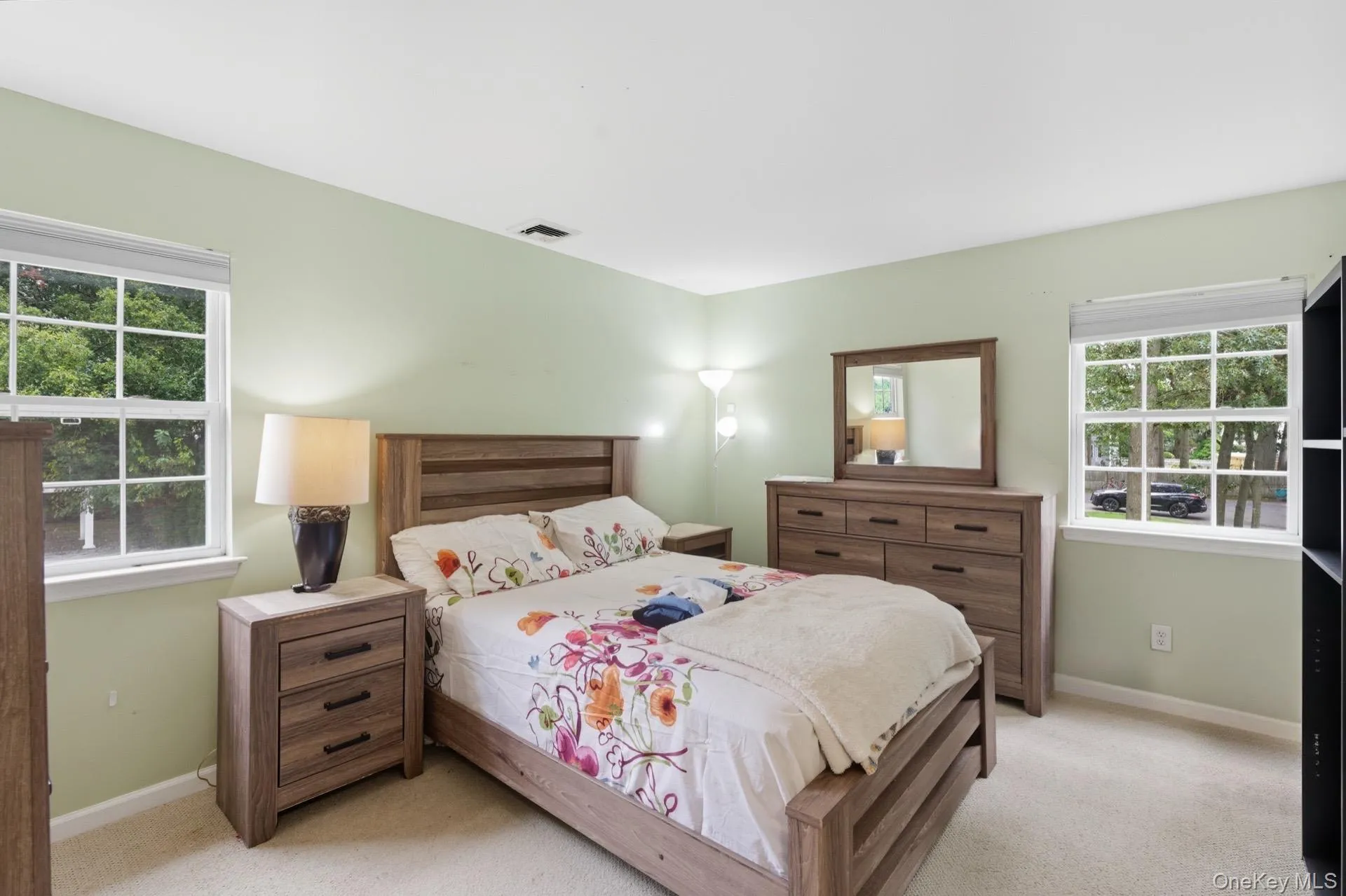 Carpeted bedroom with baseboards Carpeted bedroom with baseboards